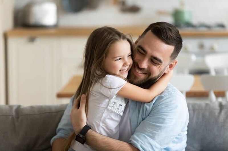 Father happily enjoying custody of his daughter